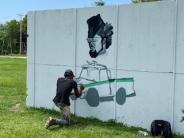 Student volunteer paints tribute mural to General Young and his beloved truck